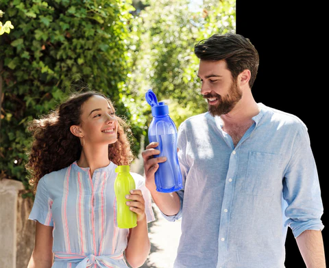 People carrying BPA-free reusable water bottles outdoors to support healthy hydration and an eco-friendly lifestyle.
